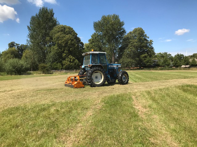 Flail mowing off the excess grass