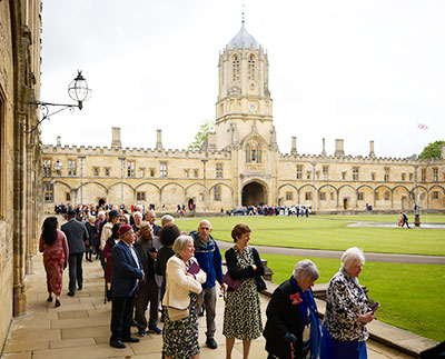 People queuing in Tom Quad before the service