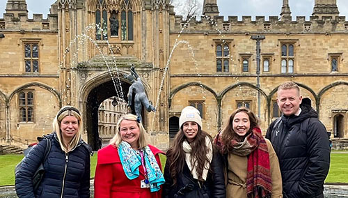 Dr Arlene Holmes-Henderson and delegates from the workshop in Tom Quad