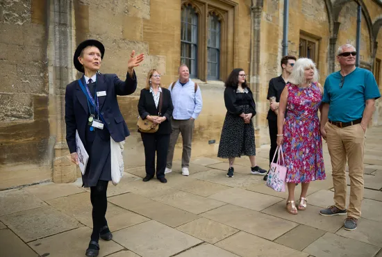 Custodian giving a guided tour of College