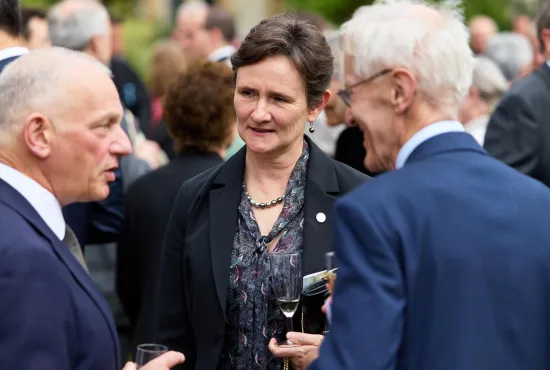 Guests chatting at a College event