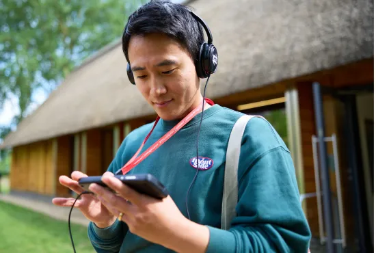 A tourist on a multimedia tour of Christ Church