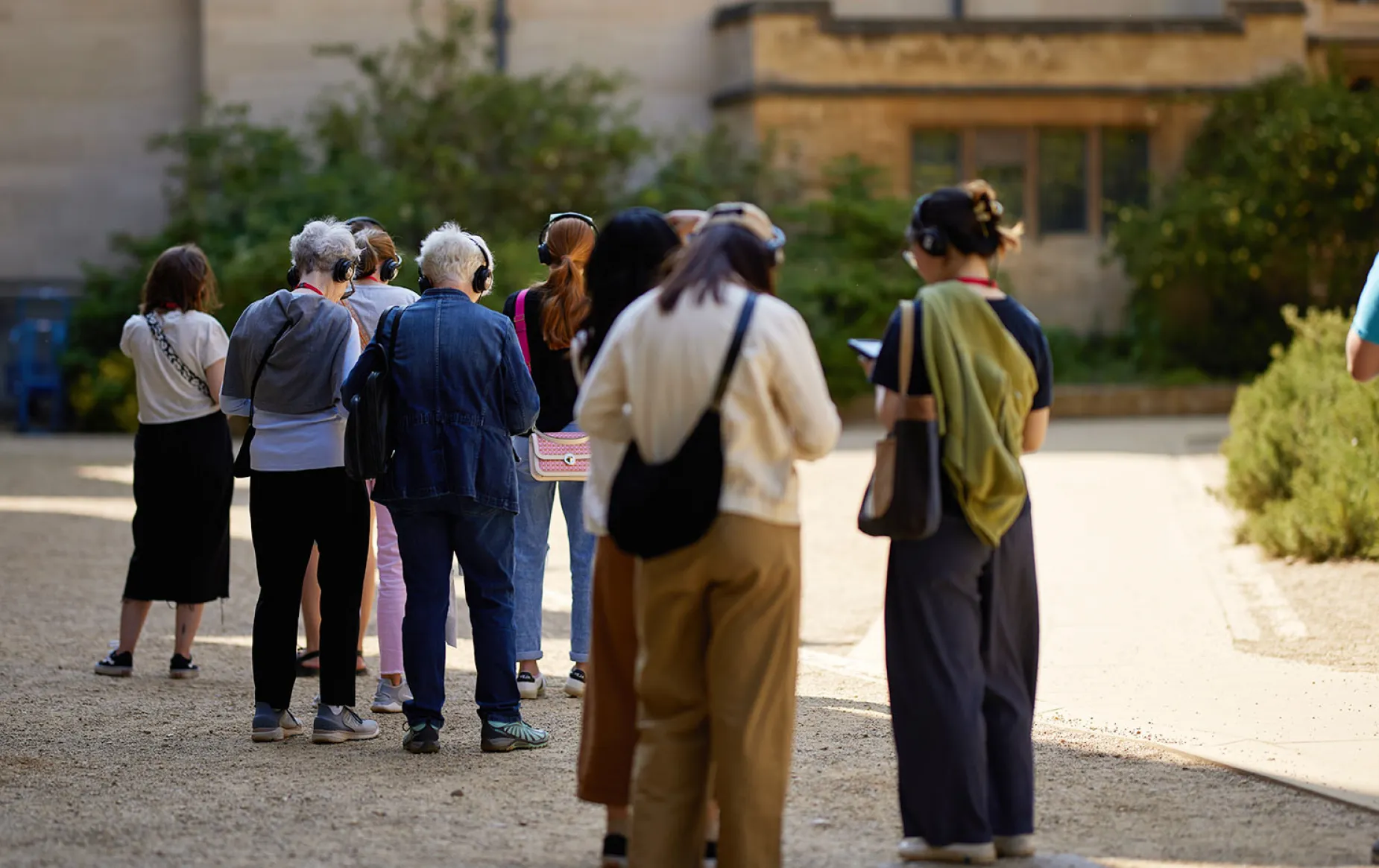 A group of visitors starting a tour using the multimedia guide