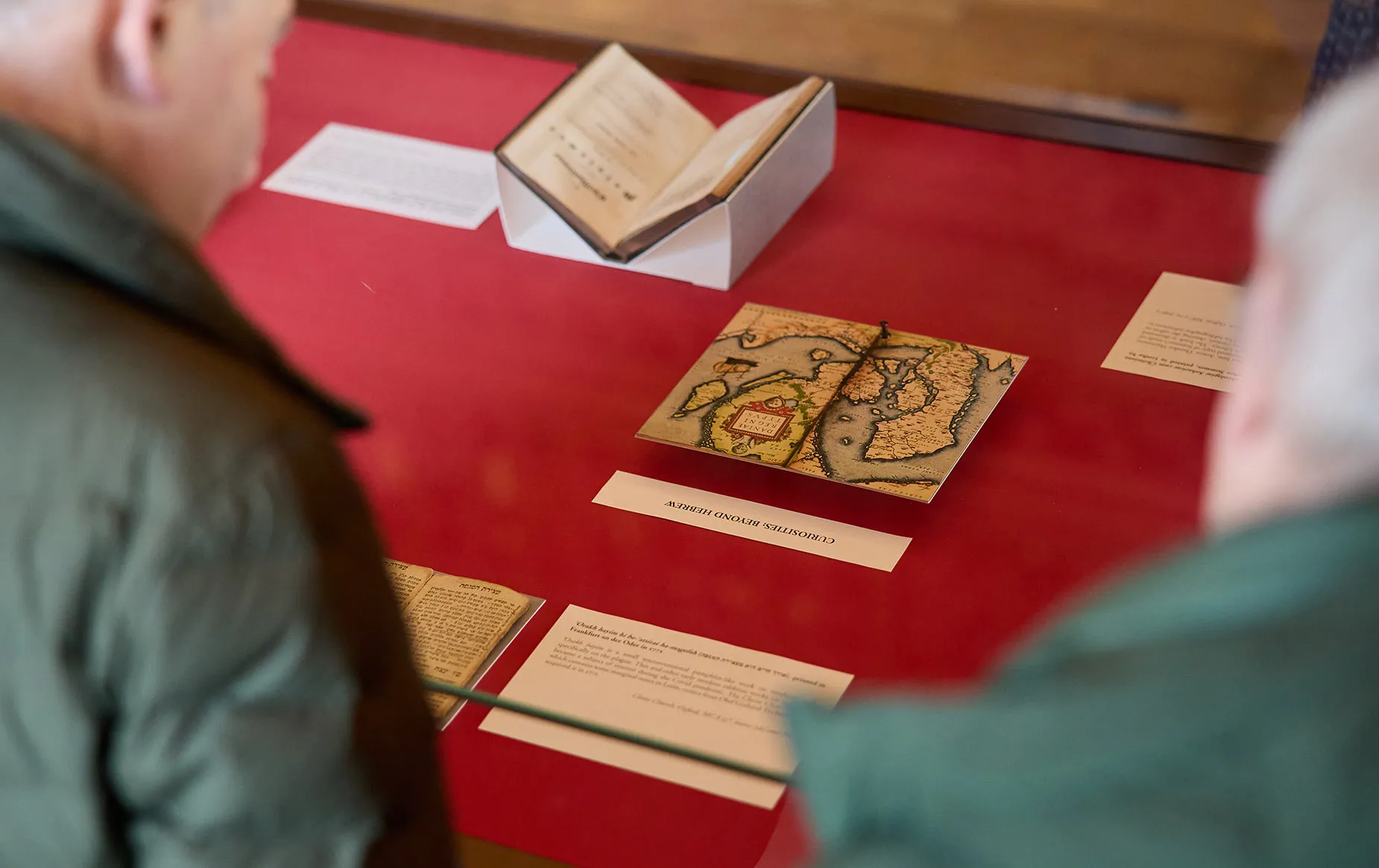 Visitors viewing a display in the Upper Library