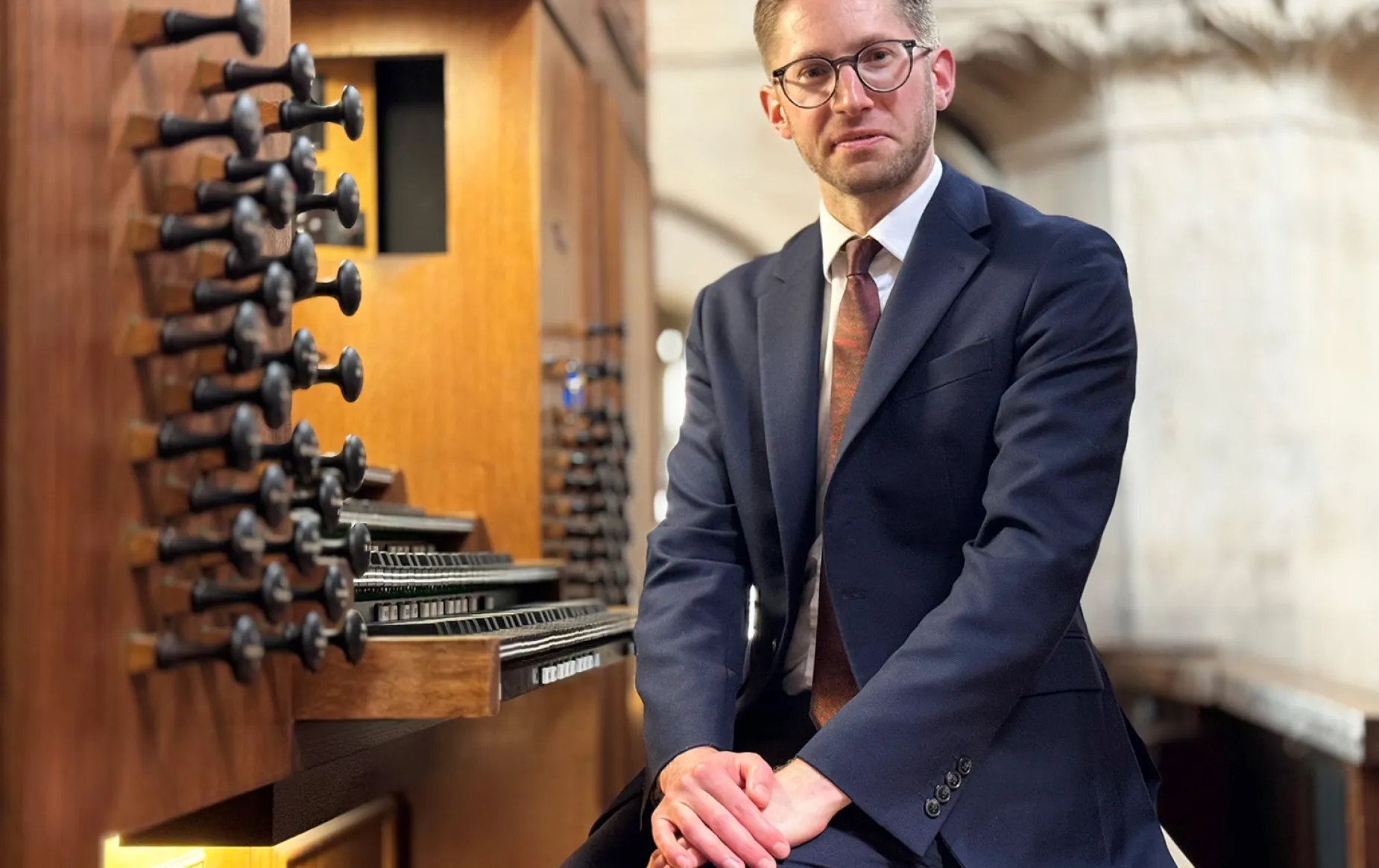 Peter Holder sitting at the Christ Church Cathedral organ