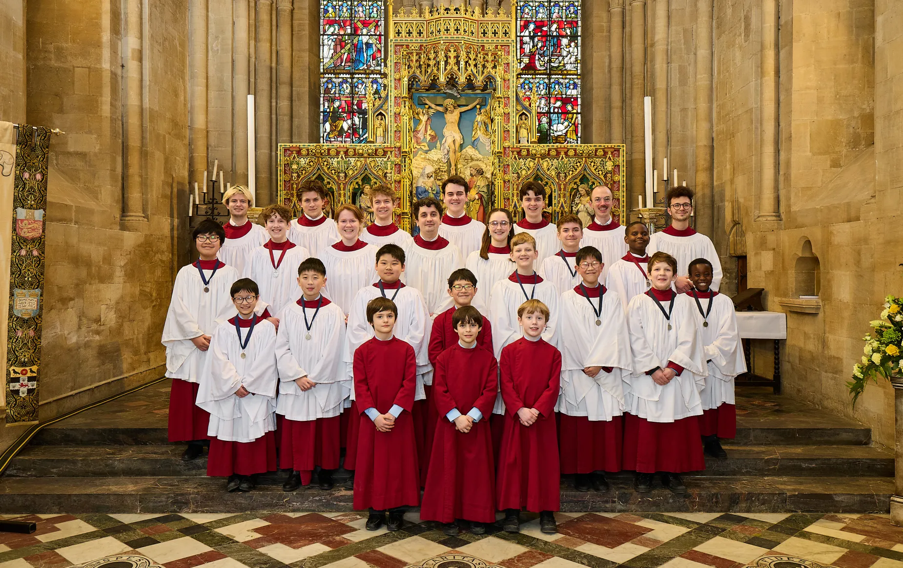 The choir, in liturgical clothing, arranged in the Cathedral sanctuary