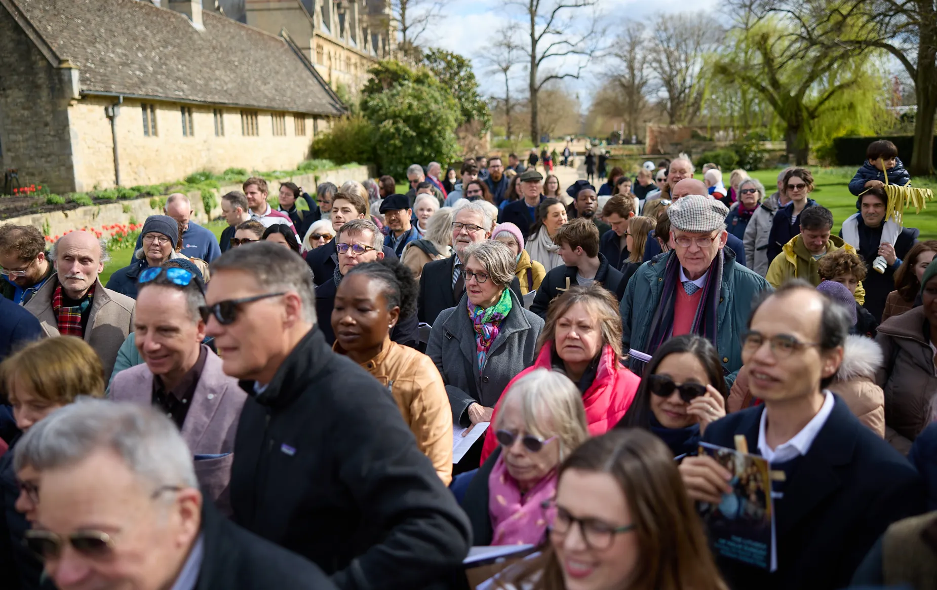 People gather in the Memorial garden, ready for the beginning of the Palm Sunday procession.