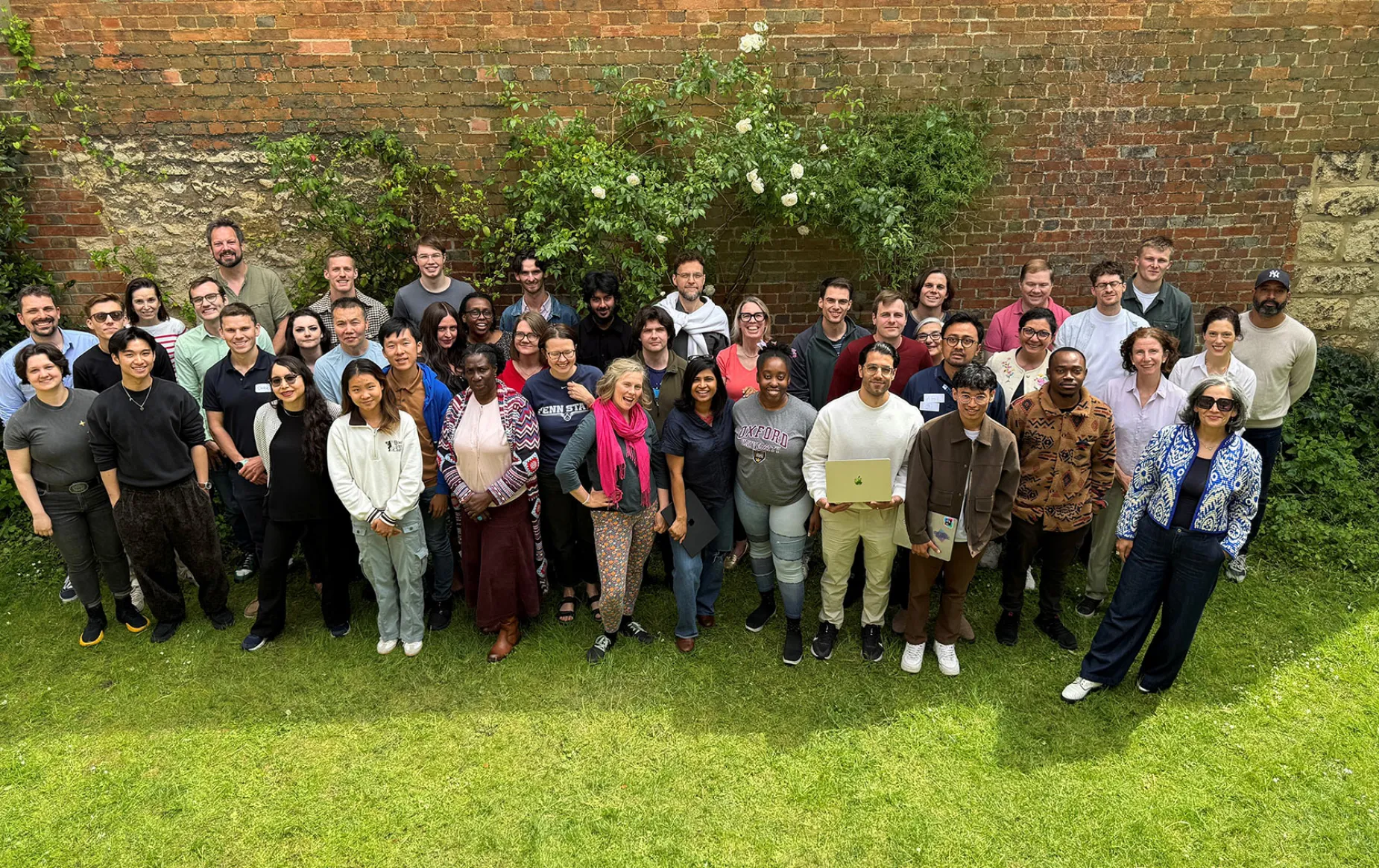 Participants in the Oxford Edge Hackathon posing in the garden