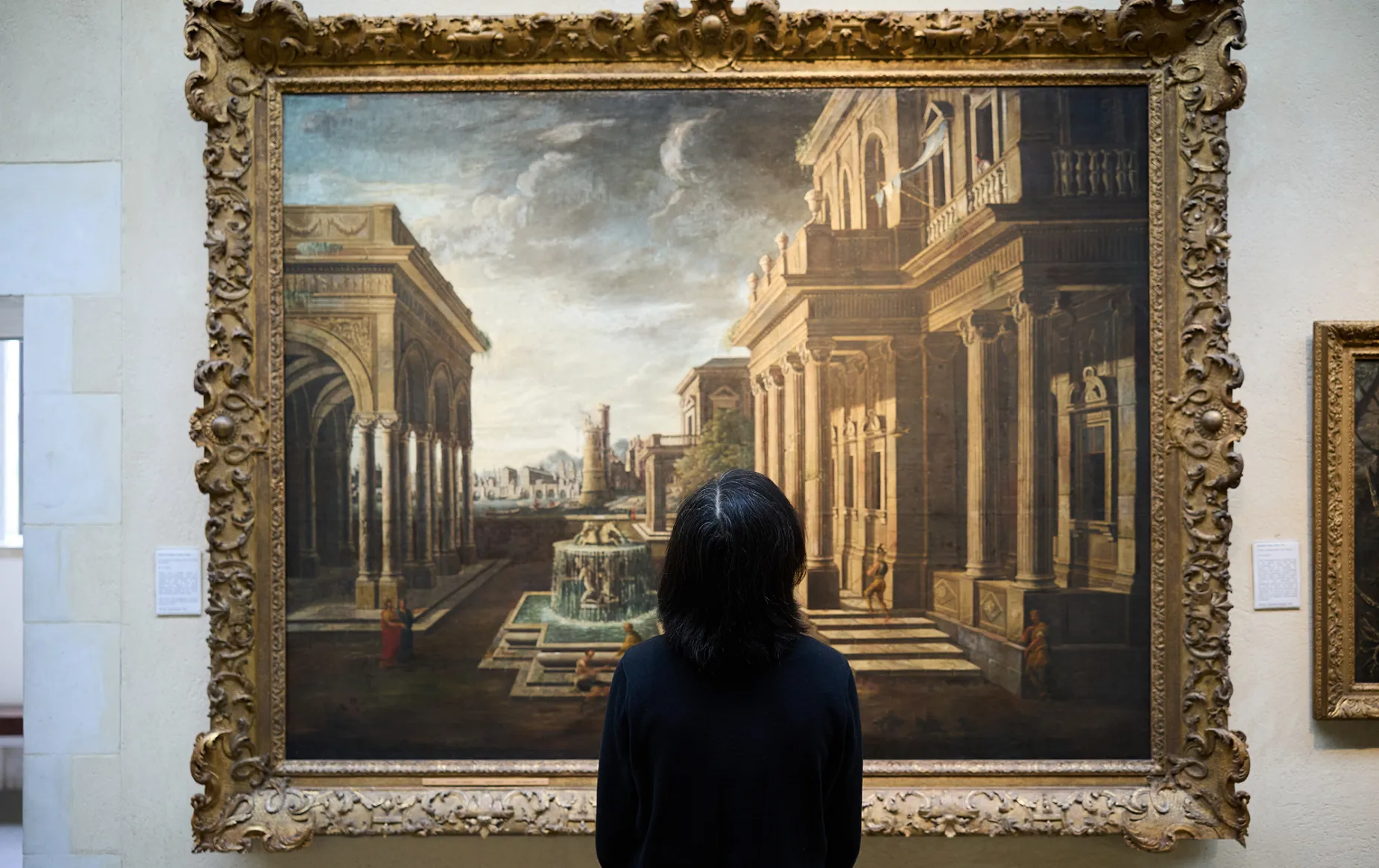 A visitor to the Picture Gallery observes a painting