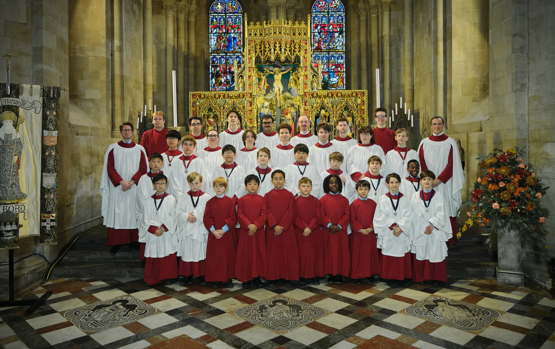 The 2025-26 Cathedral Choir in the East End of teh Cathedral, in robes