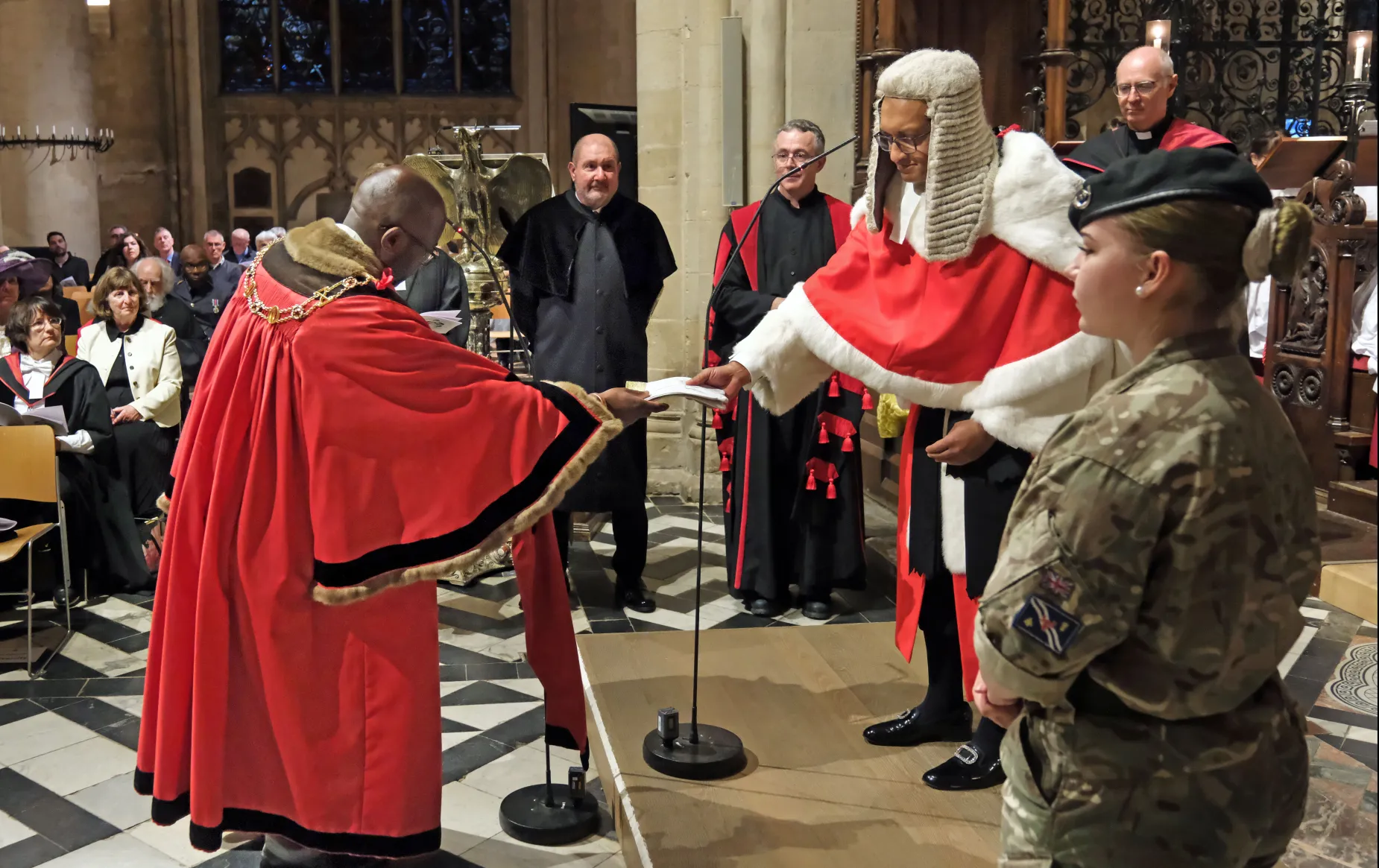 Lord Mayor Chewe Mukonge presents white gloves to Mr Justice Choudhury, both in full ceremonial dress, as part of the Glove Ceremony during the Legal Service. Credit: Nicholas Posner