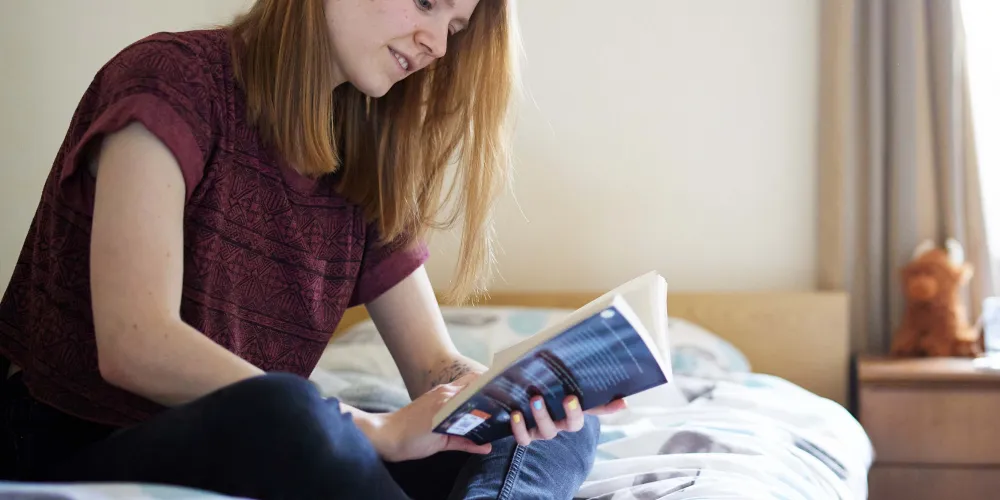 A student in her college room