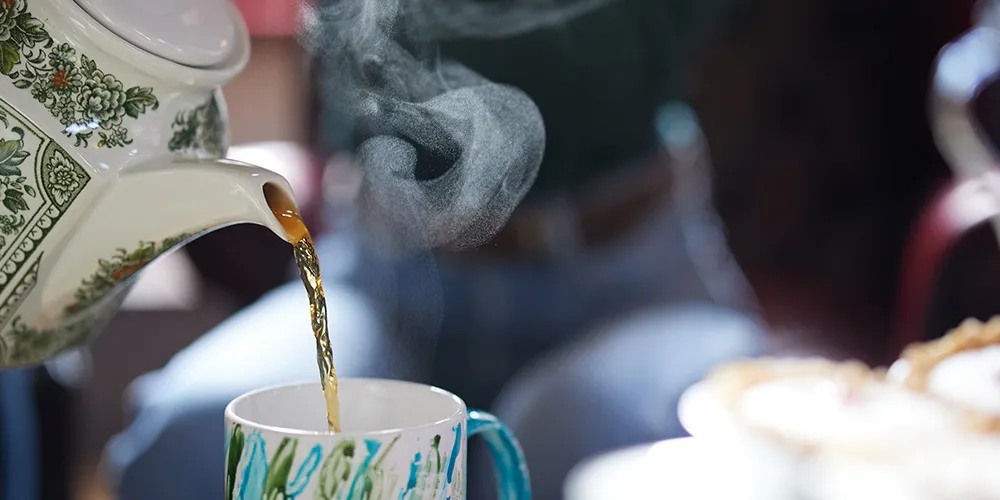 Pouring tea from a teapot