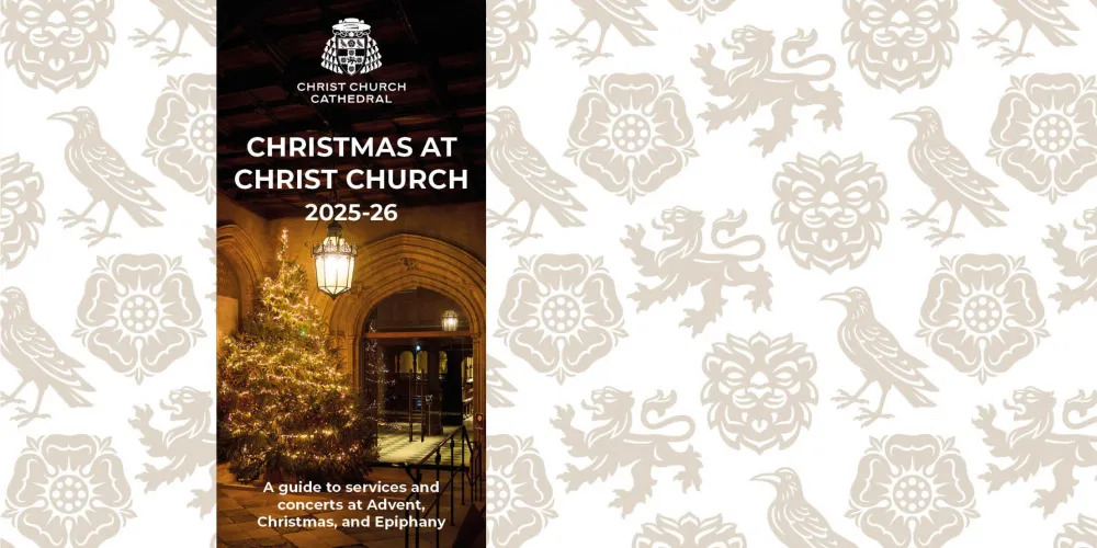 The front cover of the Christmas at Christ Church pocket guide for 2025, featuring a photo of the christmas tree outside the Cathedral doors