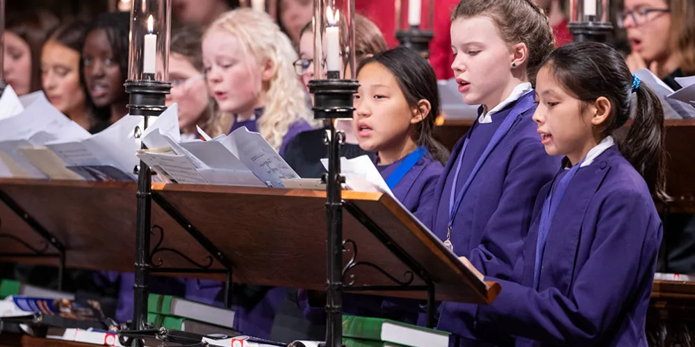 Frideswide Voices singing in the choir stalls