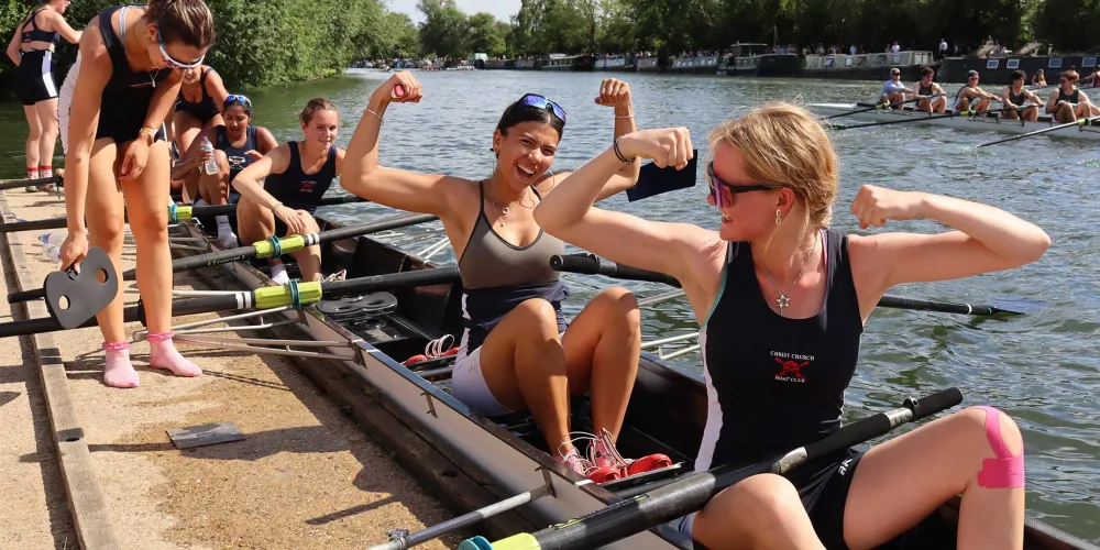 Rowers celebrating in a boat