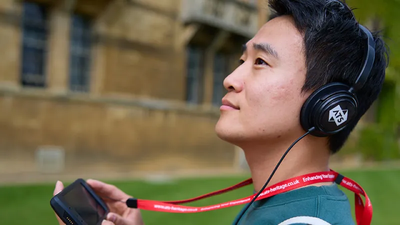 Visitor listening to the multimedia guide