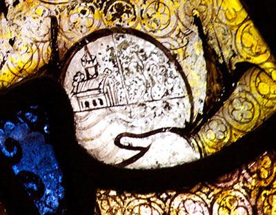 Detail from stained glass window showing the baby Jesus holding an orb