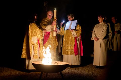 The Bishop of Oxford blesses the Easter Paschal candle over the fire