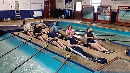 Photo of rowers training in the rowing tank