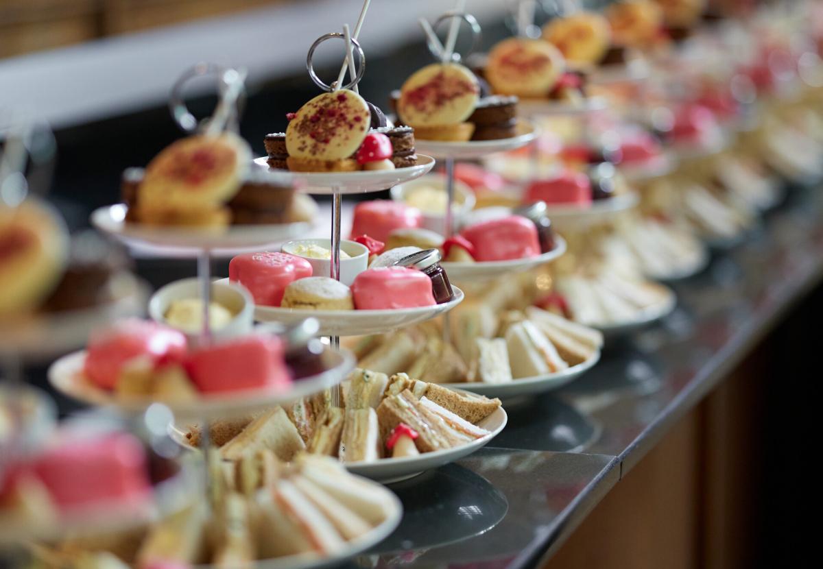 A photo showing a row of afternoon tea stands 