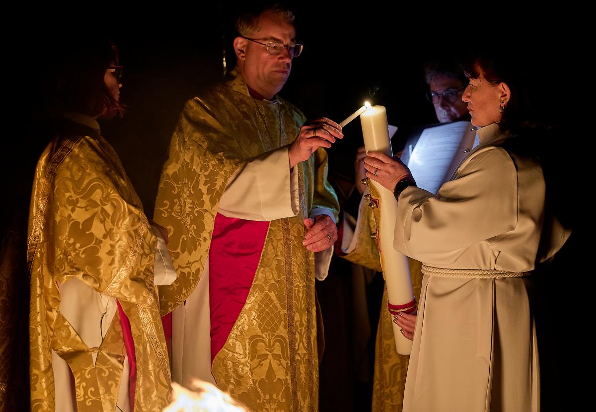 Bishop Steven lights the Paschal Candle at the Easter Vigil service, 2024
