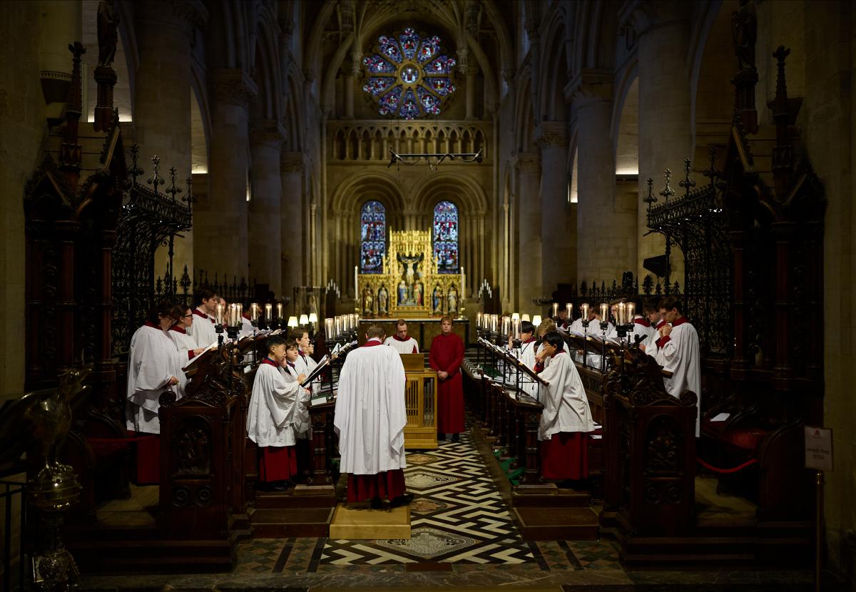 The robed choir sing in the Cathedral sanctuary.