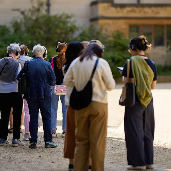 A group of visitors starting a tour using the multimedia guide