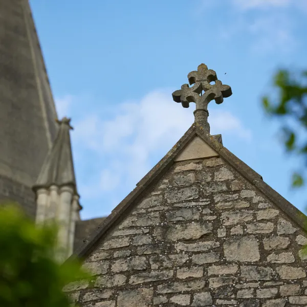 A stone cross on the roof of the north transept