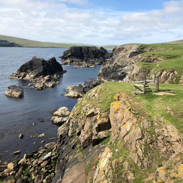 Rocky cliffs of Unst, a beautiful island in the nort of the Shetlands, with the sea below.