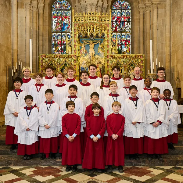The choir, in liturgical clothing, arranged in the Cathedral sanctuary