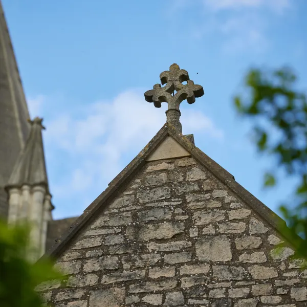 A stone cross on a roof of Christ Church Cathedral