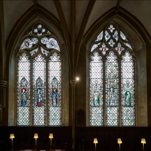 Two stained glass windows in the Latin Chapel of Christ Church cathedral, showing 6 saints in medieval glass. The windows are too far away for the saints names to be read.