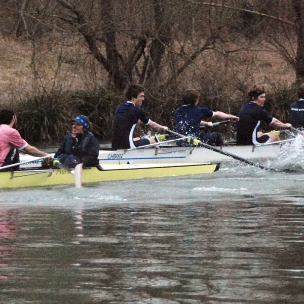 Two boats in close competition during Torpids