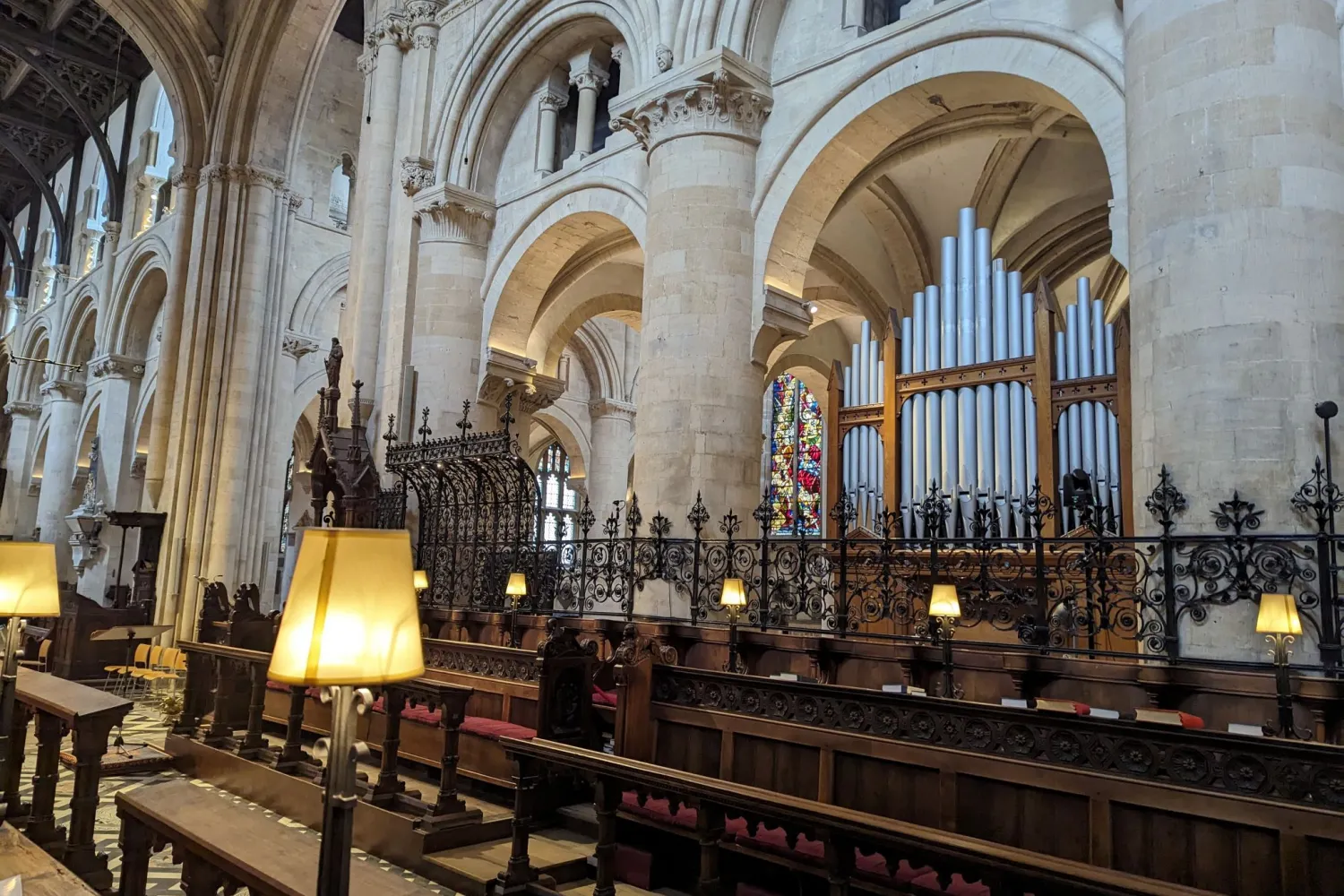 A view of the Chancel, with the former chancel organ visible under the arches