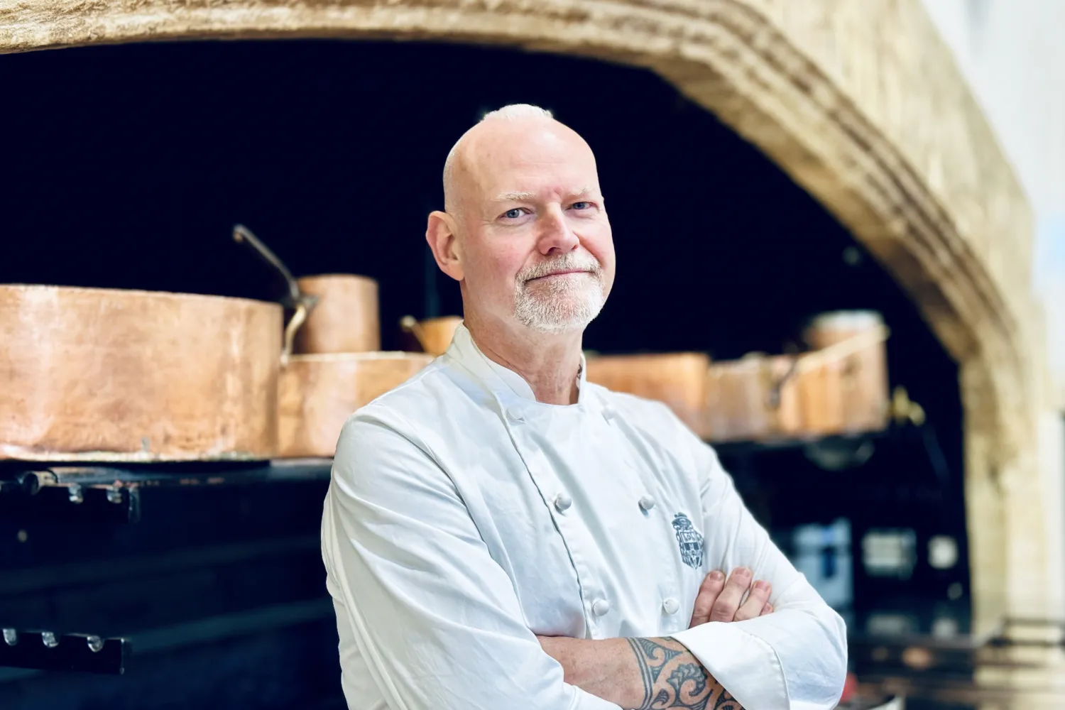 Executive Head Chef Chris Simms, in front of our Tudor fireplace in the kitchen