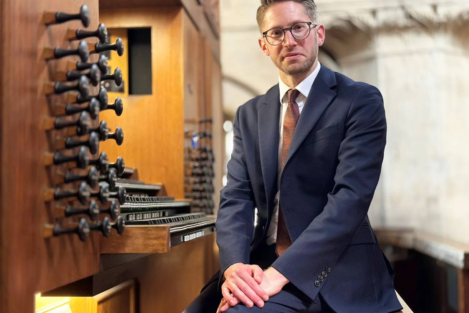 Peter Holder sitting at the Christ Church Cathedral organ