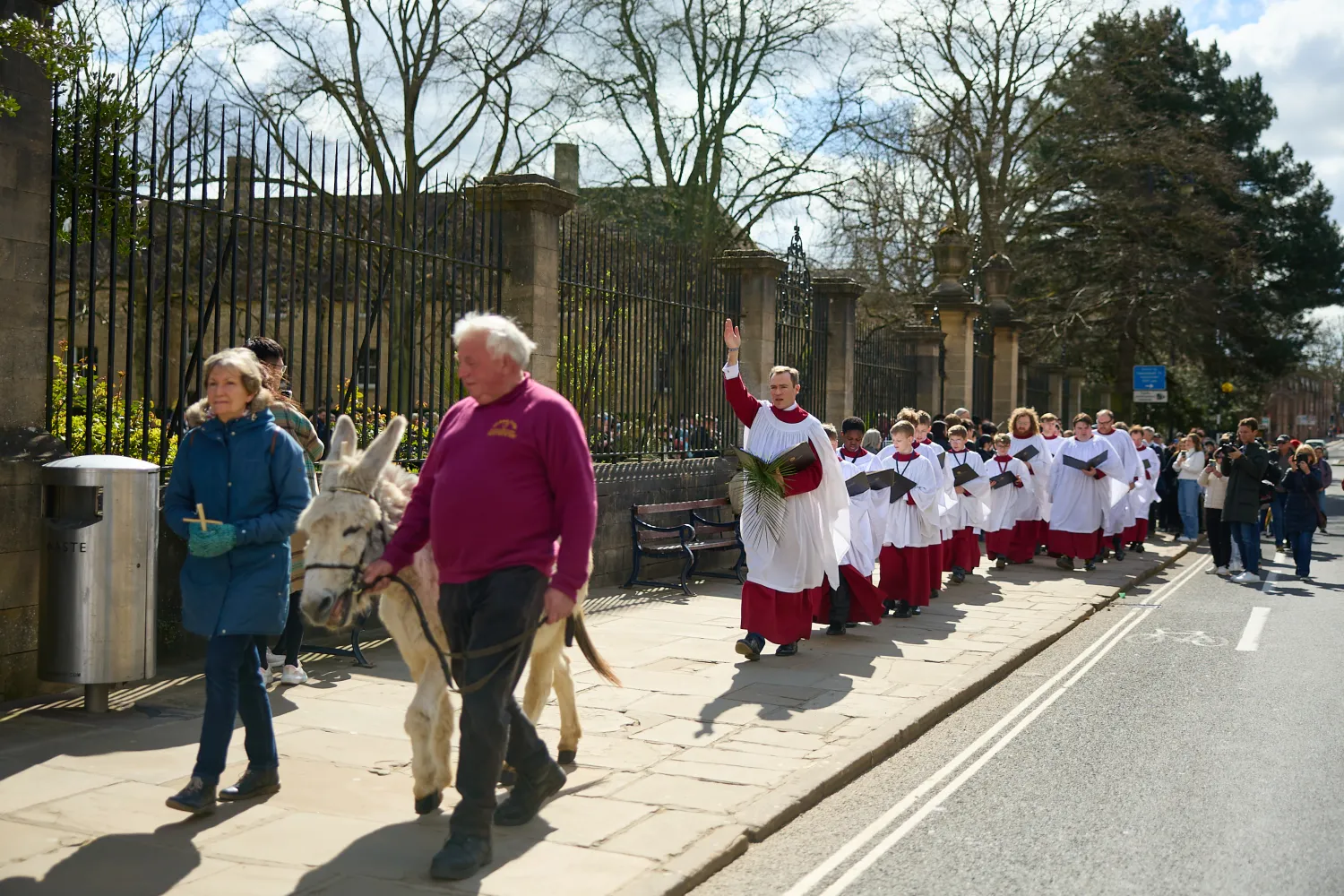 Monty the donkey leads Christ church Cathedral Choir down st aldates during their Palm Sunday procession