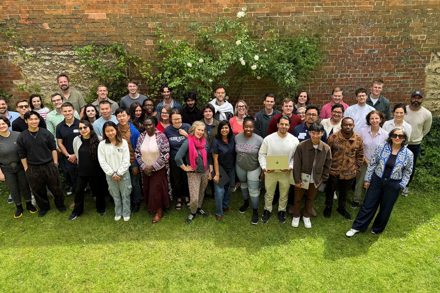 Participants in the Oxford Edge Hackathon posing in the garden