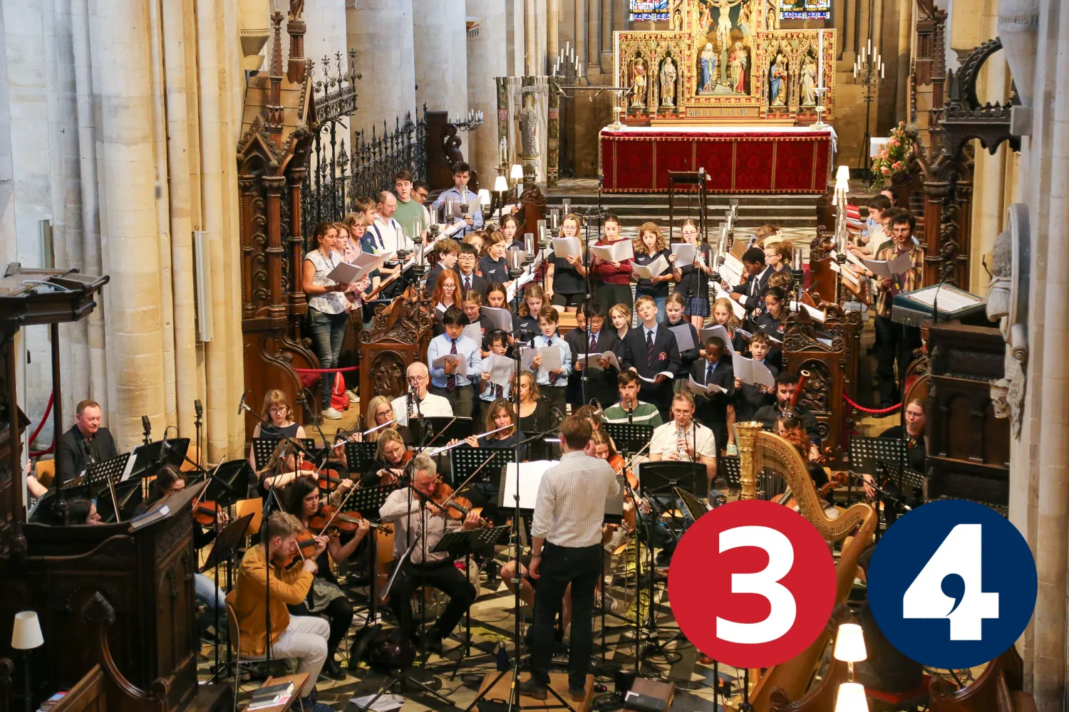Peter holder conducts the Cathedral Choir, frideswide voices and an orchestra in the Cathedral, surrounded by recording microphones