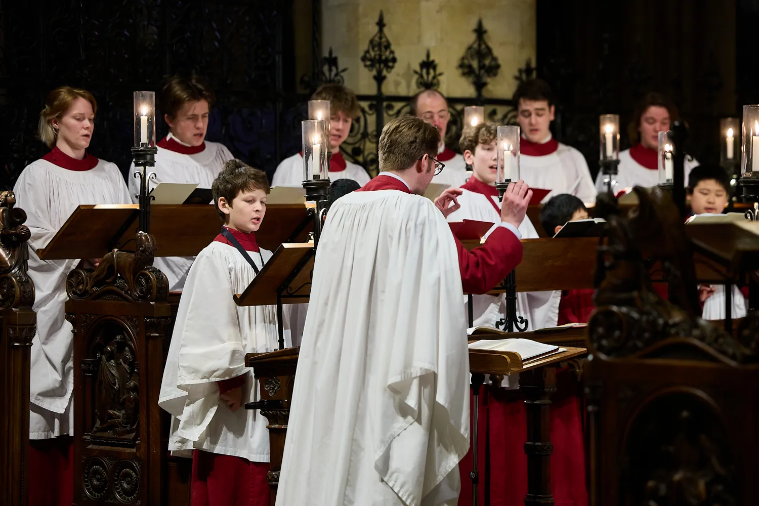 Peter Holder conducts the cathedral choir during a service
