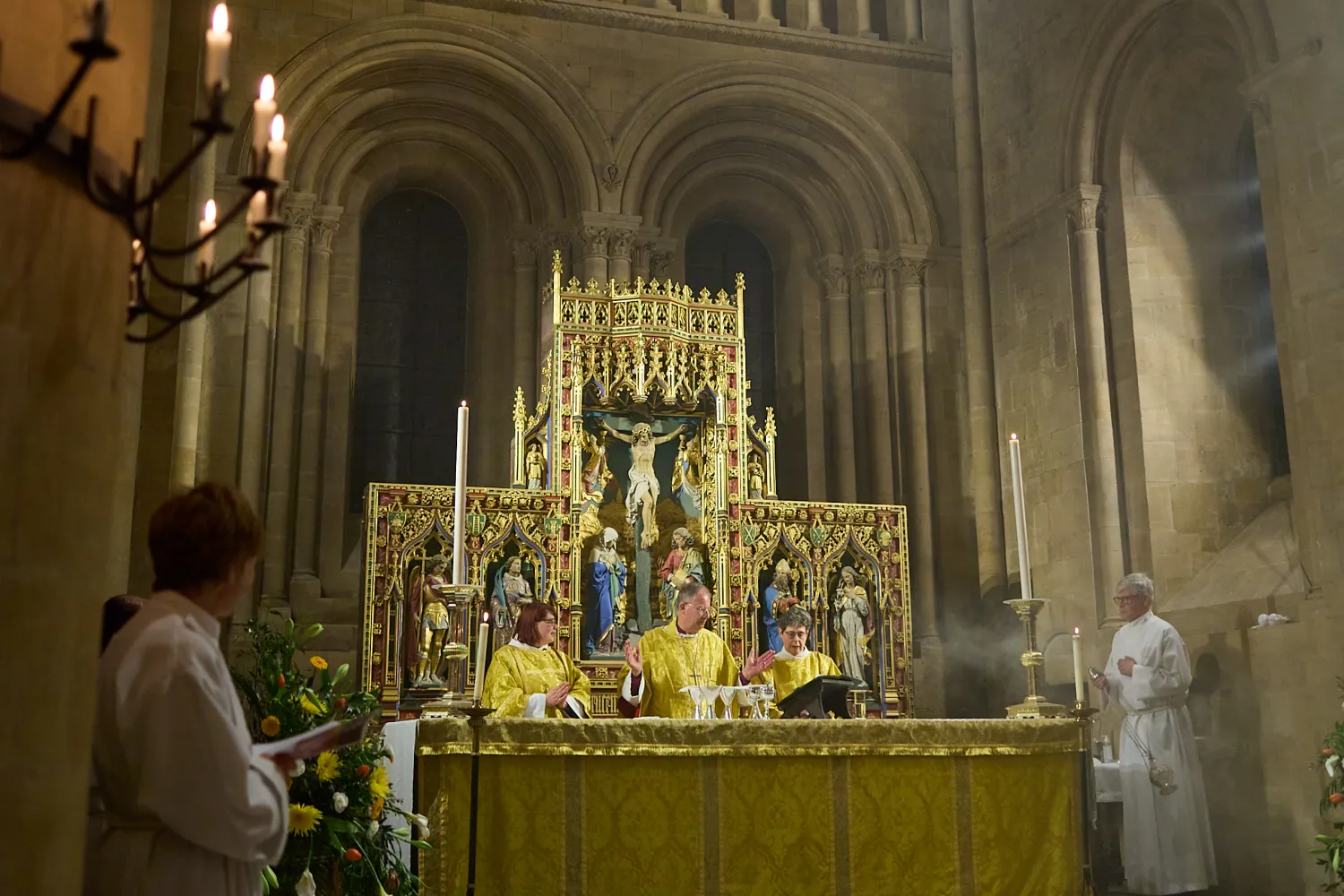 The Bishop of Oxford, The Rt Revd Dr Steven Croft, the Dean, The Very Revd Professor Sarah Foot, and Revd Philippa White celebrate communion during the 2023 Easter Vigil service