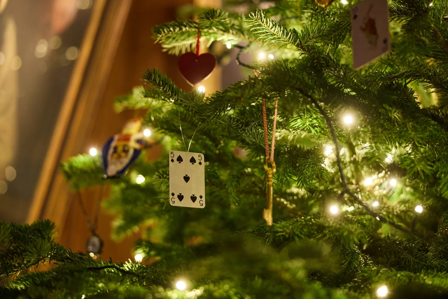 A close up of a Christmas tree in Hall with Alice in Wonderland themed decorations