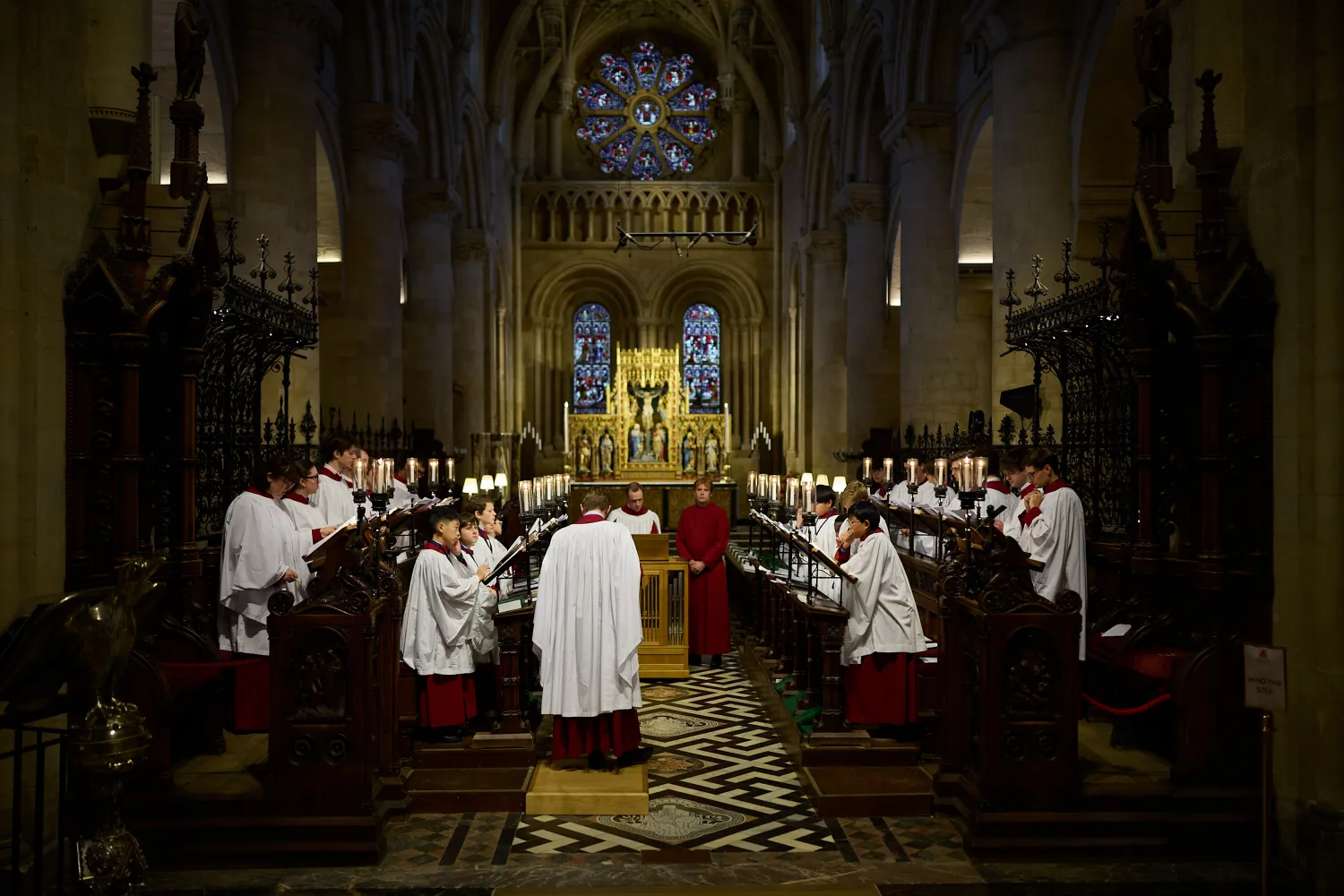 The robed choir sing in the Cathedral sanctuary.
