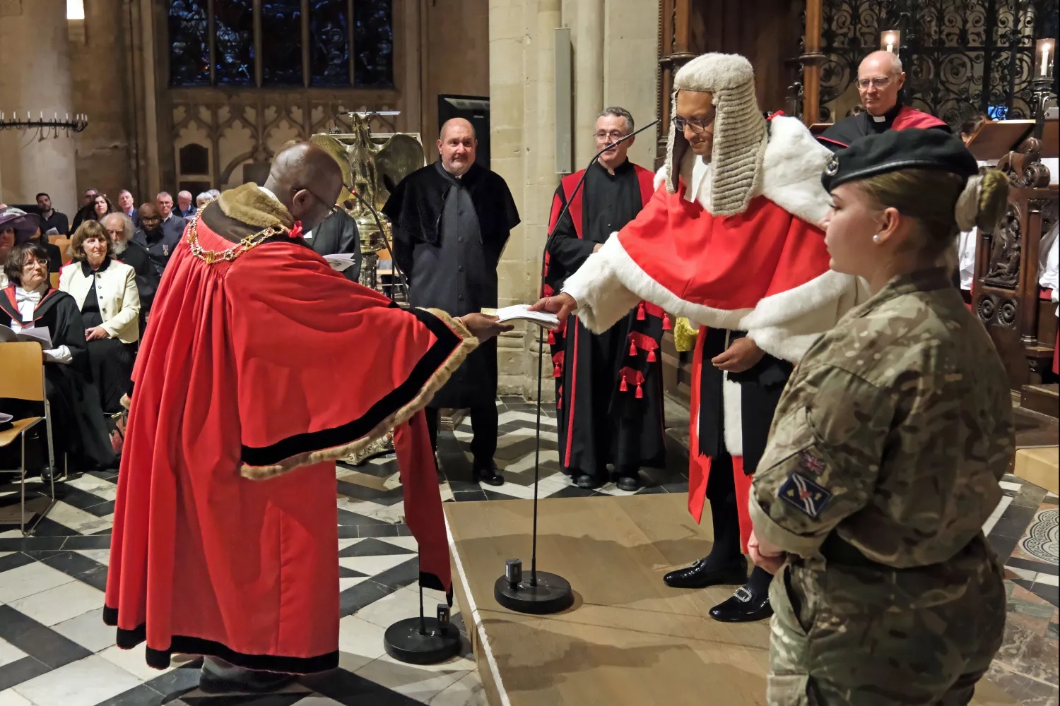 Lord Mayor Chewe Mukonge presents white gloves to Mr Justice Choudhury, both in full ceremonial dress, as part of the Glove Ceremony during the Legal Service. Credit: Nicholas Posner