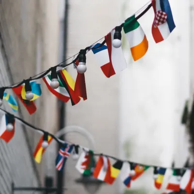 Smal flags from different countries hung above an alleyway