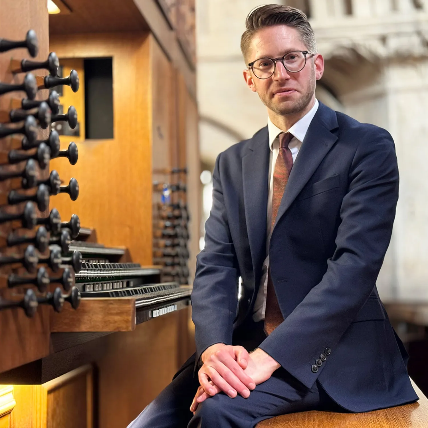 Peter Holder sitting at the Christ Church Cathedral organ