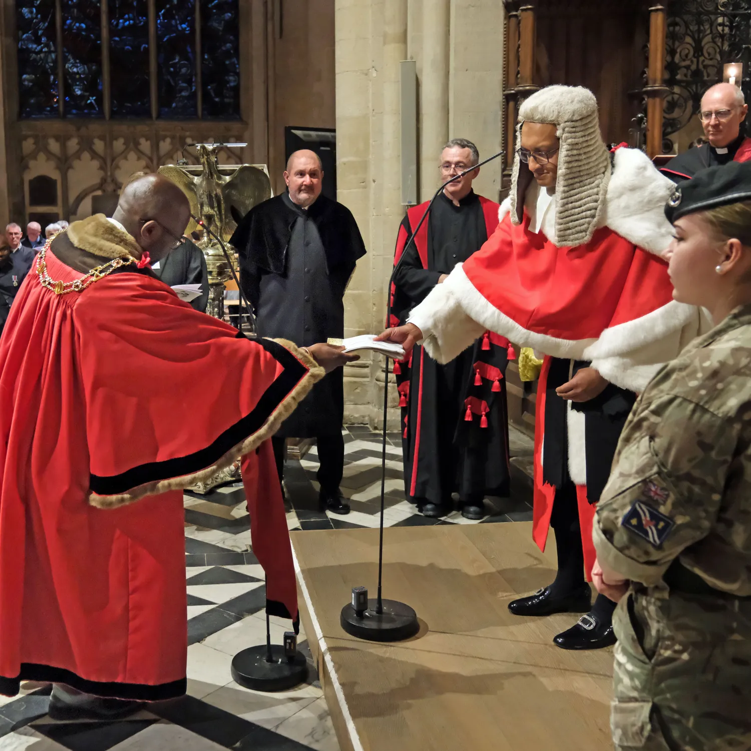 Lord Mayor Chewe Mukonge presents white gloves to Mr Justice Choudhury, both in full ceremonial dress, as part of the Glove Ceremony during the Legal Service. Credit: Nicholas Posner